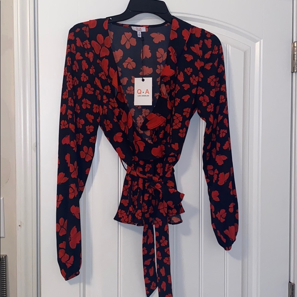 Vici black and red floral dressy top.
